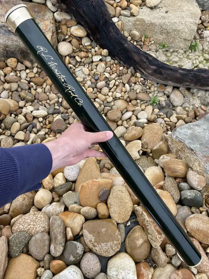 Fly rod tube case for protection while hiking in the forest