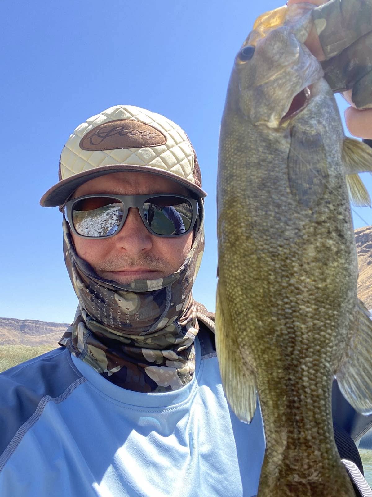 Big smallmouth bass (smallie) caught while fly fishing