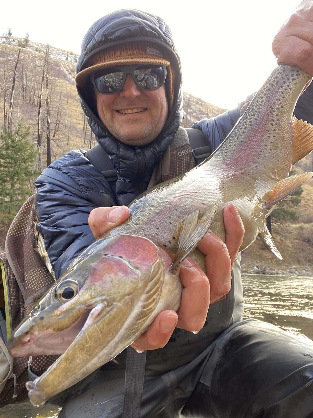 Fly fishing for rainbow trout on a river