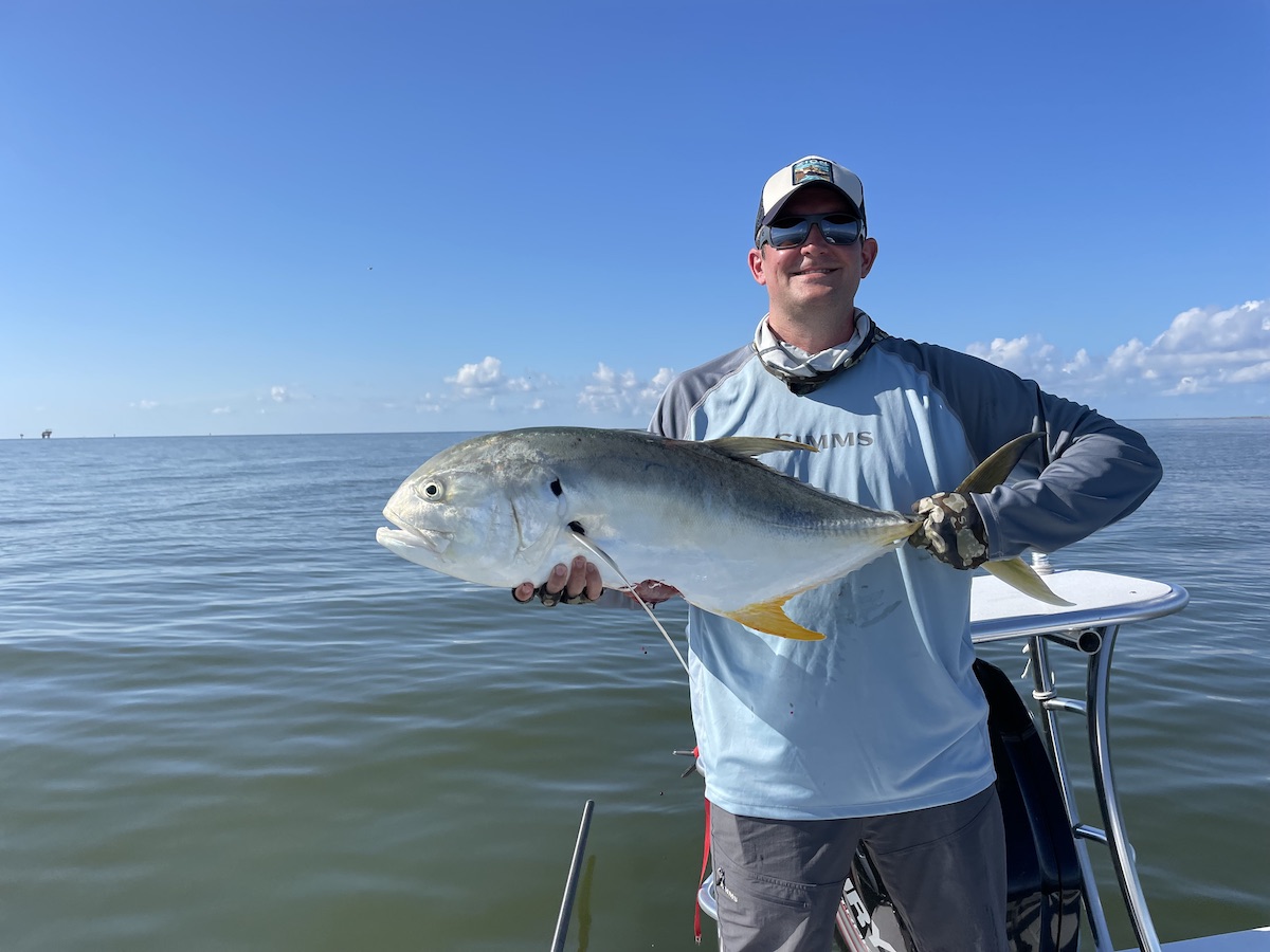 Large crevalle jack caught while fly fishing with popper