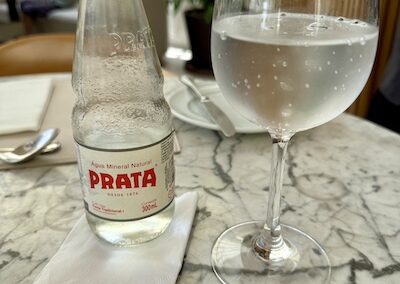 Drinking Prata bottled water at the restaurant